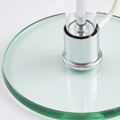 Modern chrome glass table lamp with clear glass base, polished chrome column, and visible power cord for bedroom decorbites glass table lamp