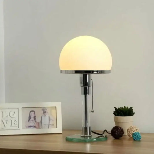 Modern chrome glass table lamp with a sleek chrome finish, clear glass base, and warm frosted dome shade for bedroom decorbites glass table lamp