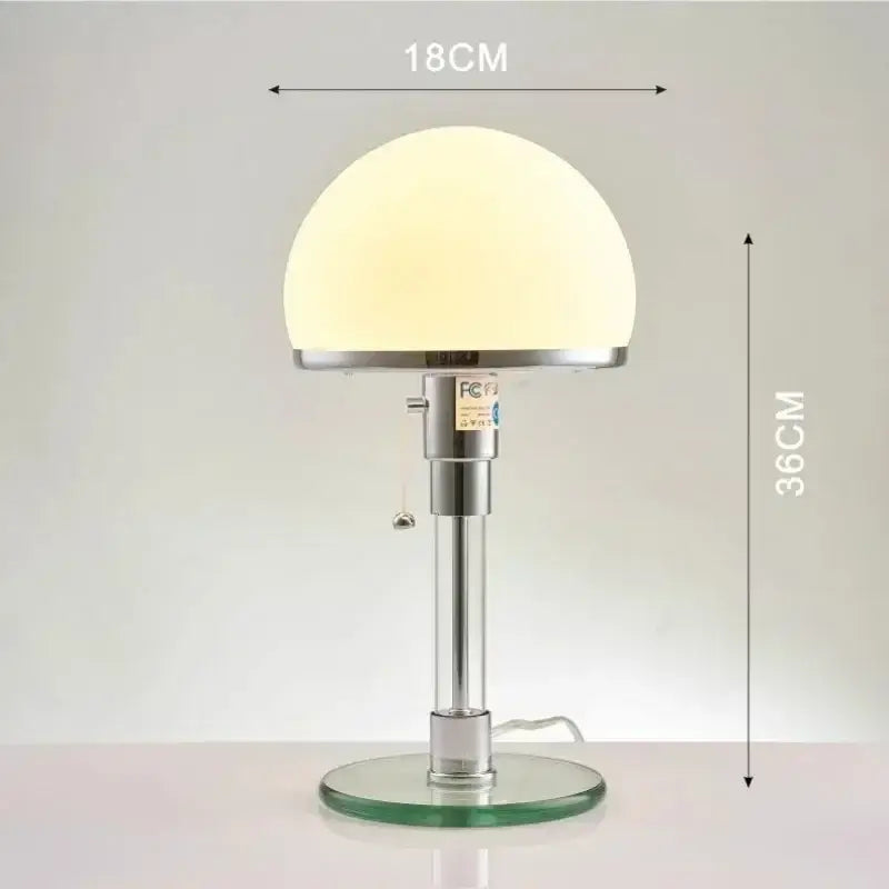 A sleek modern chrome glass table lamp with a frosted white dome shade for stylish bedroom decorbites glass table lighting