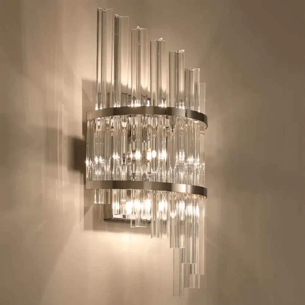 Modern wall lamp featuring clear glass rods with polished chrome and gold rings in a crystal prism sconce design