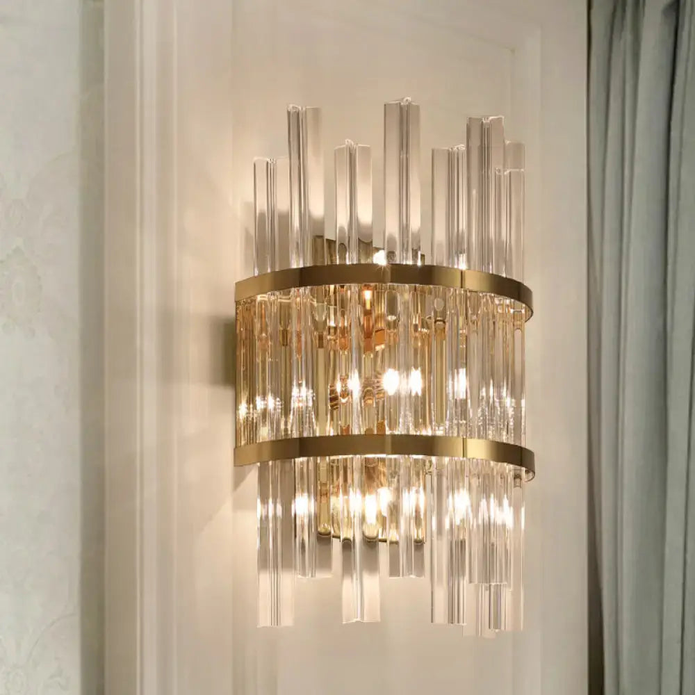 Gold-toned modern chrome gold crystal prism sconce wall lamp with vertical crystal rods and circular metallic bands for living room