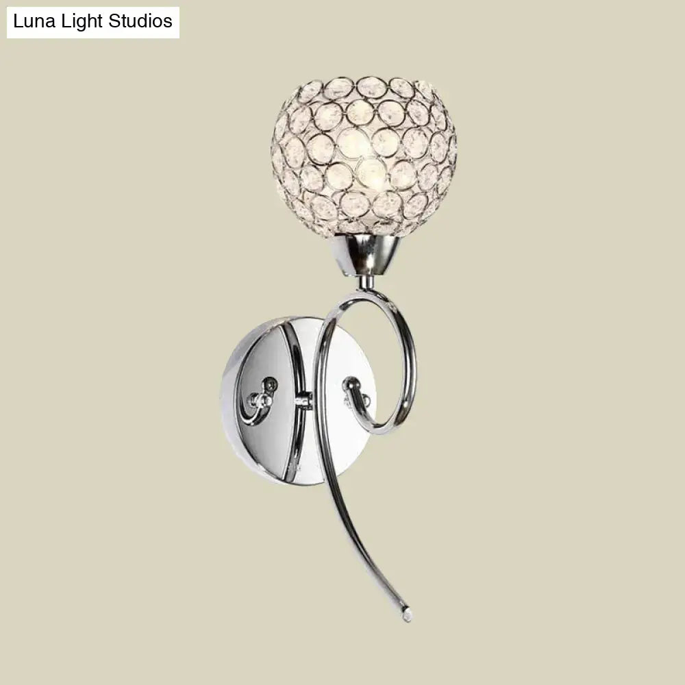 Modern chrome hemisphere crystal wall lamp featuring a chrome finish and spherical crystal diffuser for bedroom lighting
