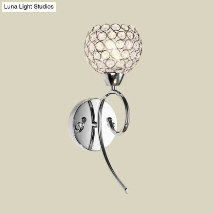 Modern chrome hemisphere crystal wall lamp featuring a chrome finish and spherical crystal diffuser for bedroom lighting