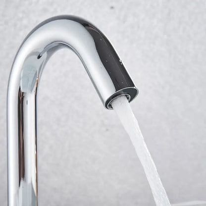 Modern chrome infrared sensor faucet with sleek curved spout and flowing water by decorbites infrared sensor faucet