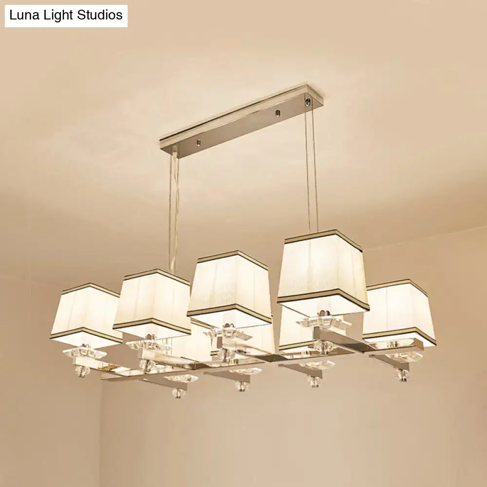 Modern chrome island pendant light with five cream fabric shades and metal arms ideal for dining rooms island pendant light kit