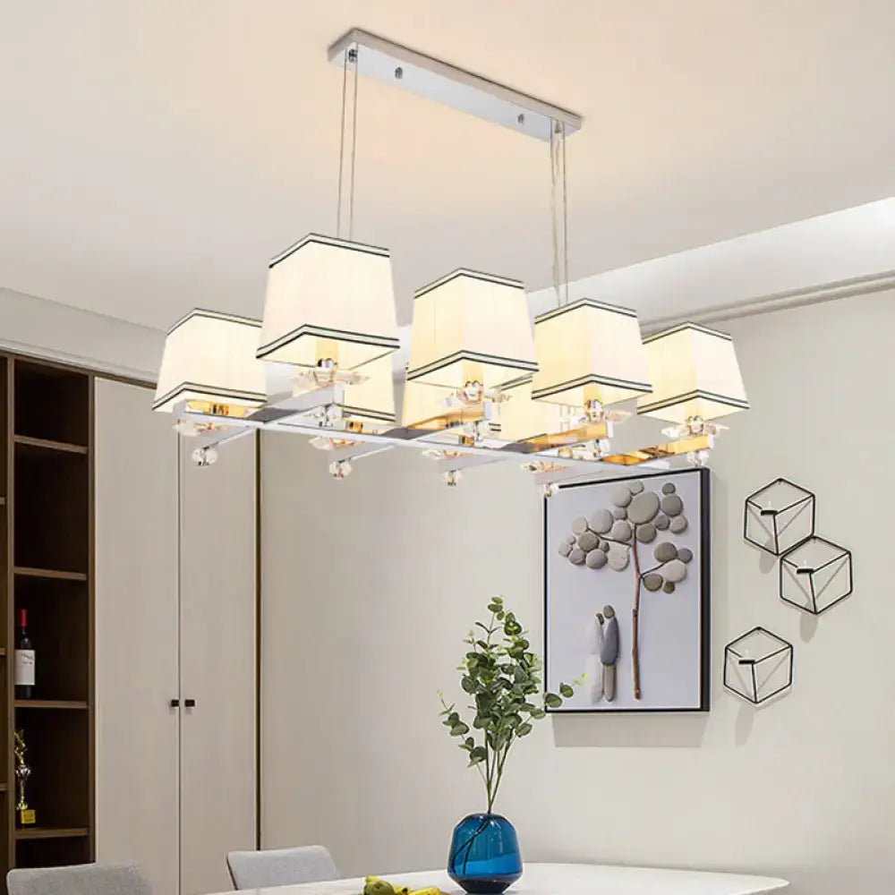Modern chrome island pendant light with six cream shades and gold-toned fixtures ideal as an island pendant light kit