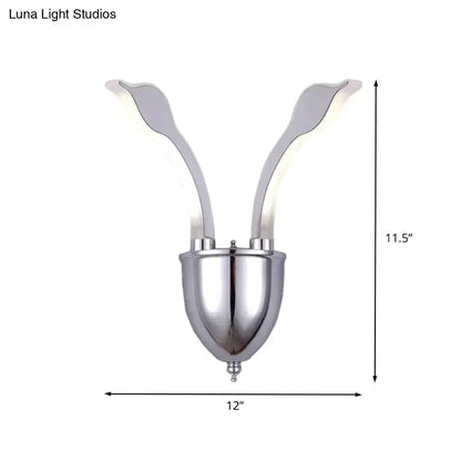Modern chrome leaf led wall sconce with two warm white light acrylic shade arms extending upward from a rounded base