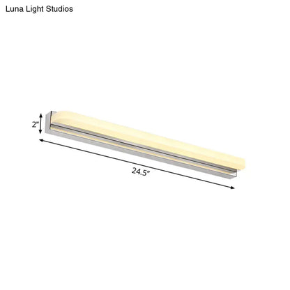 Modern chrome led wall mounted vanity light with a warm cream diffuser and metallic silver frame for bathroom use