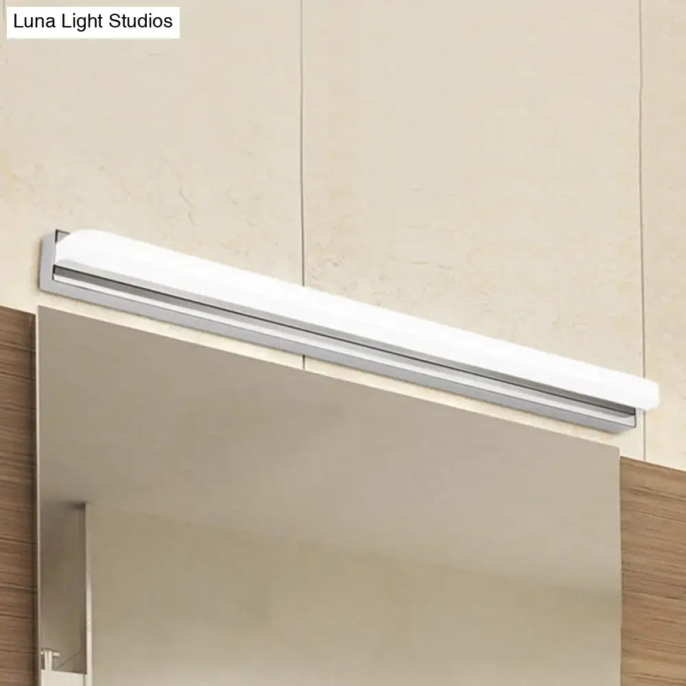 A modern chrome led wall mounted vanity light in white and silver mounted above a bathroom vanity mirror