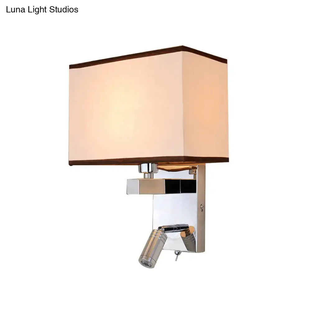 Modern chrome led wall sconce lighting with cream fabric shade and polished metal frame featuring adjustable reading spotlight