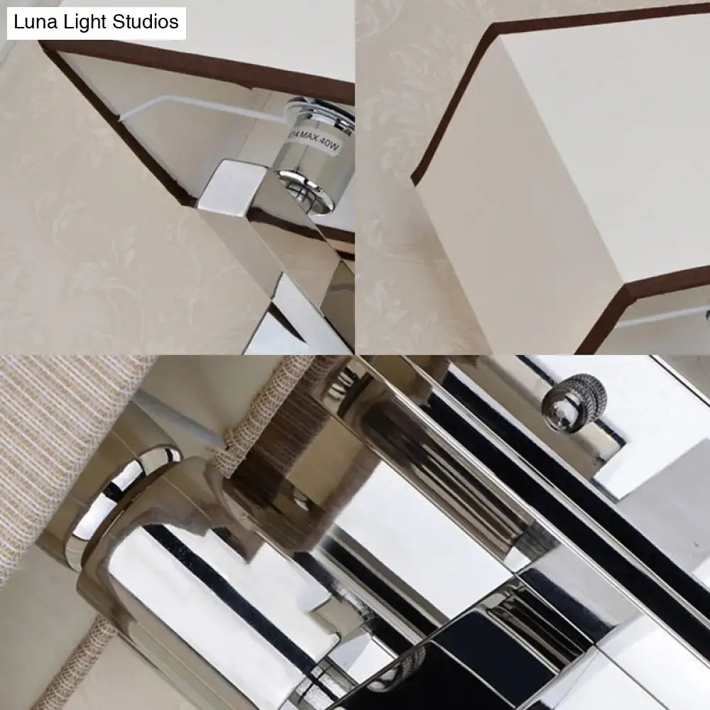 Modern chrome led wall sconce lighting with sleek geometric design and white fabric shade accented by dark brown trim