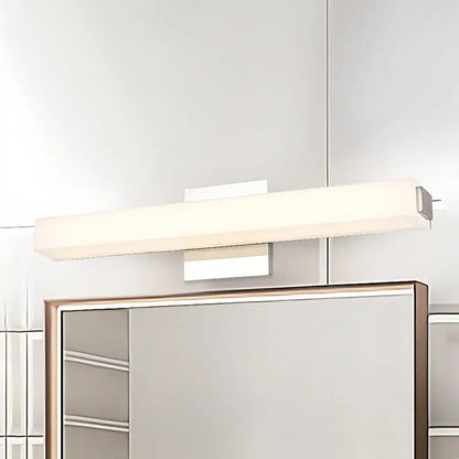 Modern chrome led wall sconce with sleek white diffuser and polished chrome finish providing warm white light for vanity use