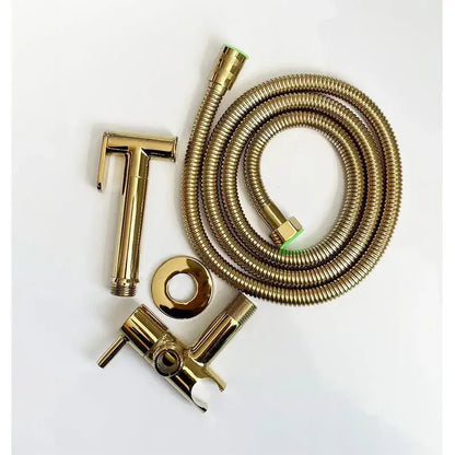 Gold-colored brass bidet spray set with flexible corrugated hose and matching showerhead for modern bathroom use