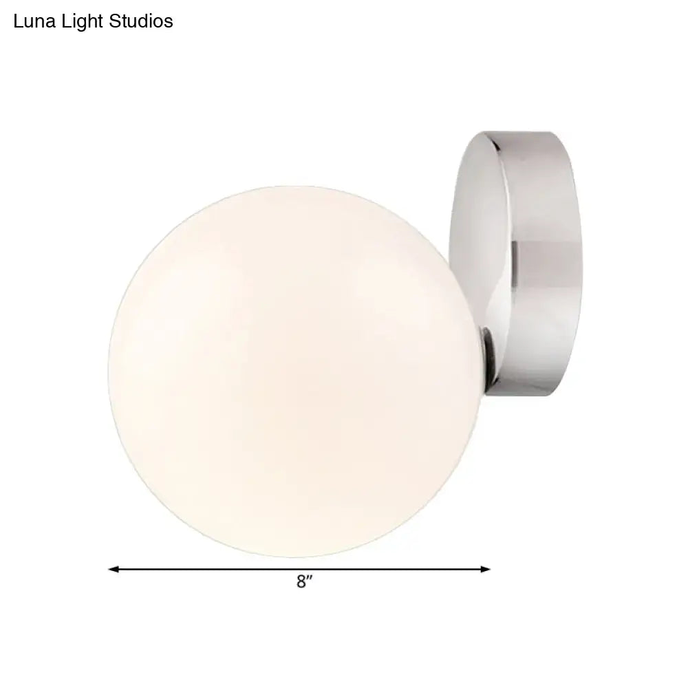 Modern chrome milk glass globe wall lamp with frosted glass and polished chrome bracket for living room lighting