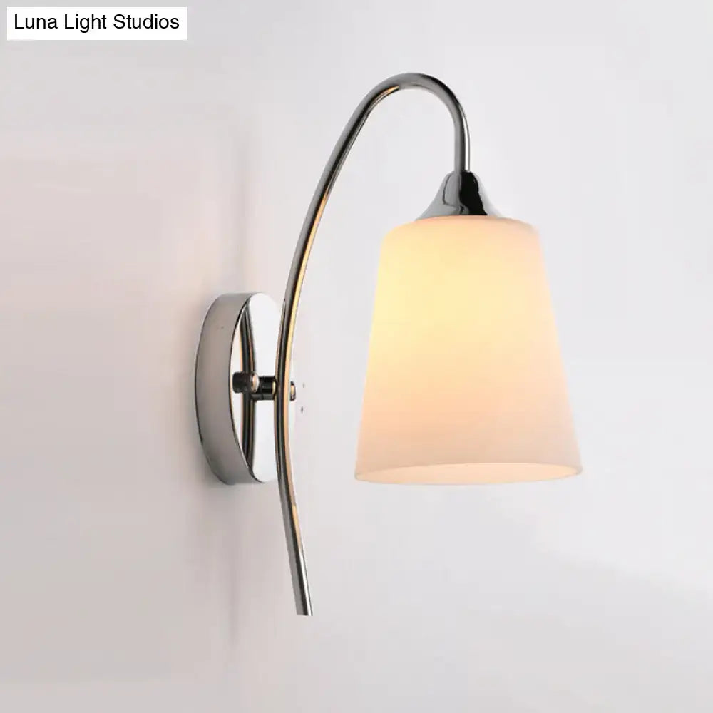 Modern chrome milky glass trumpet wall sconce with curved arm and warm frosted shade for stairway lighting