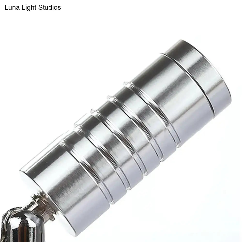 Silver cylindrical magnetic keychain with segmented ribbed design showcasing modern chrome mini tubed wall lamp white warm lighting
