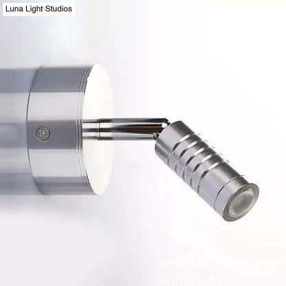 A sleek modern wall lamp with mini tubed polished chrome design providing warm and white bathroom lighting