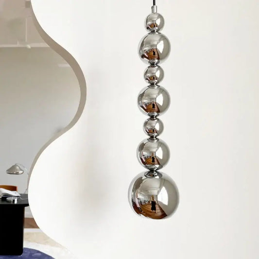 Modern chrome multi ball pendant light source with polished chrome spheres stacked vertically for bedroom hanging lamp