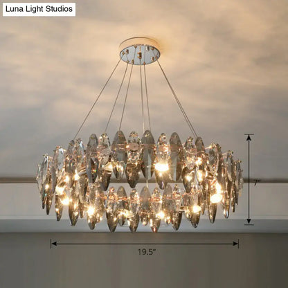 A two-tiered minimalist oval crystal clear pendant chandelier with faceted teardrop crystals and chrome mount for 220v-240v use