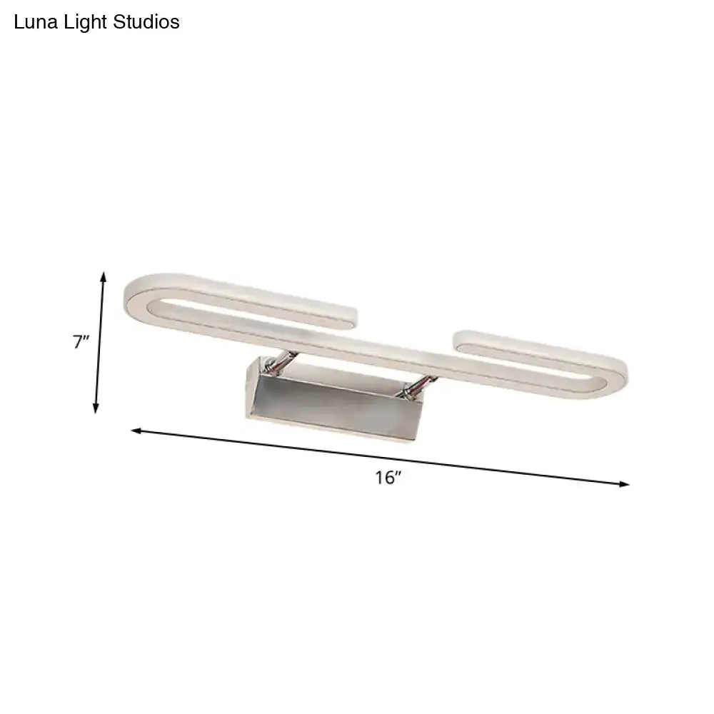 Modern chrome paper clip vanity light fixture with sleek curved design and brushed metallic finish for bathroom use