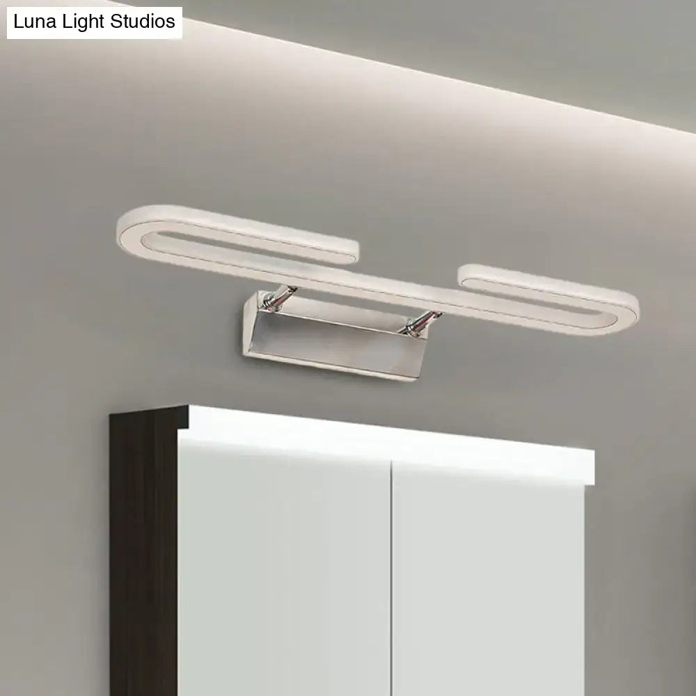 Modern chrome paper clip vanity light fixture with sleek curved white acrylic arms and minimalist rectangular base for bathroom