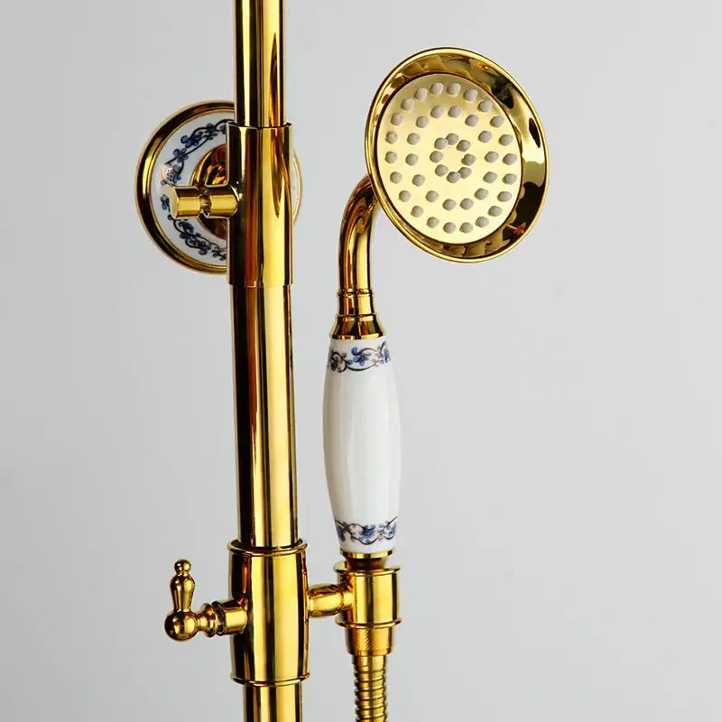 Modern chrome rain shower faucet set featuring a gold finished shower faucet with white ceramic handle and blue floral accents