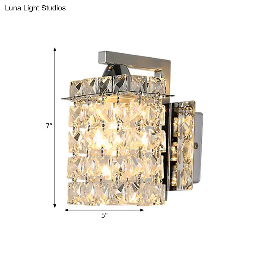 A modern chrome rectangle crystal wall light with faceted clear crystals refracting warm ambient light 110v-120v