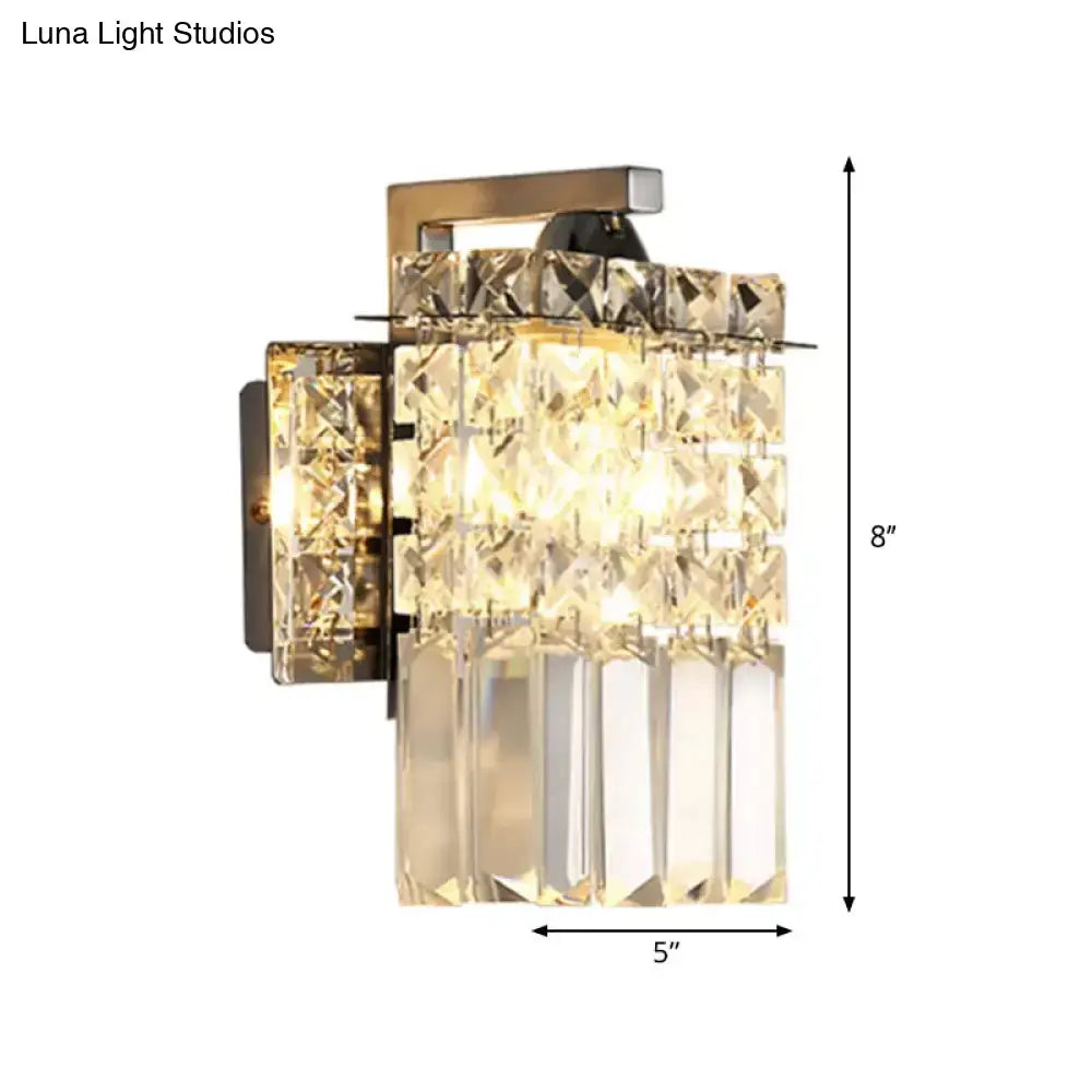 Gold-toned crystal wall light with faceted clear crystals in a tiered rectangular design for 110v-120v or 220v-240v use