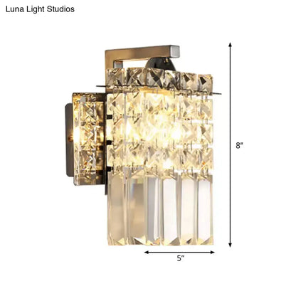 Gold-toned crystal wall light with faceted clear crystals in a tiered rectangular design for 110v-120v or 220v-240v use