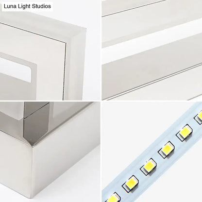 Modern chrome rectangular led sconce bathroom wall light with sleek metallic silver casing and evenly spaced yellowish leds