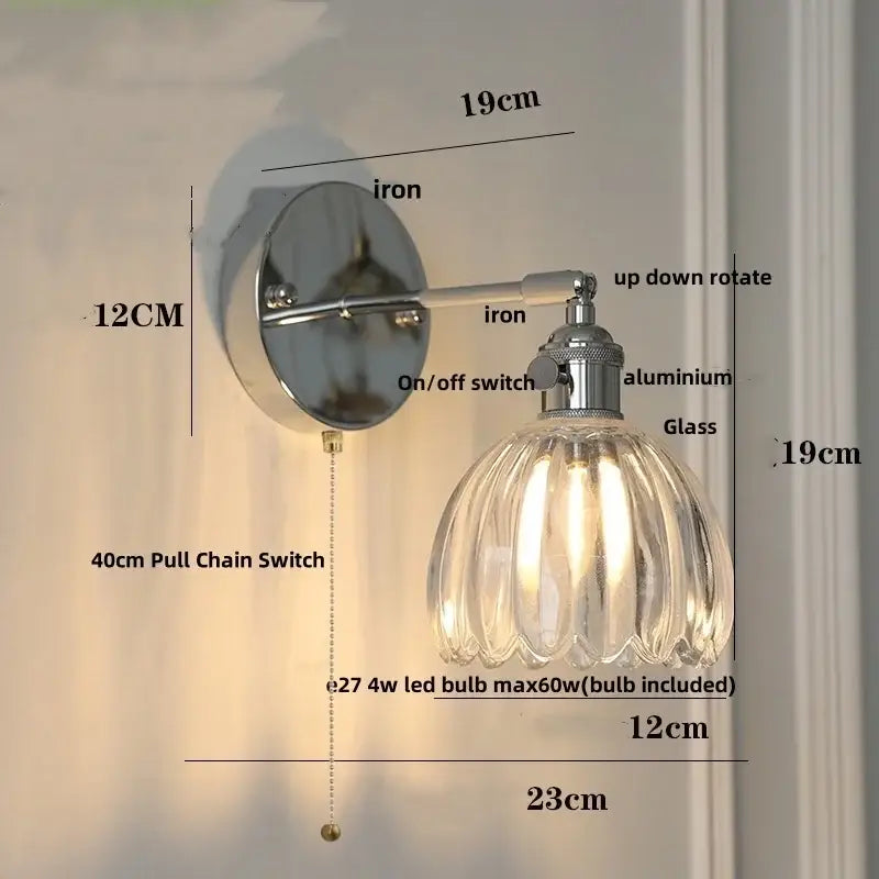Modern chrome wall lamp with a clear ribbed glass shade and polished iron bracket for bedroom decorbites clear glass lighting