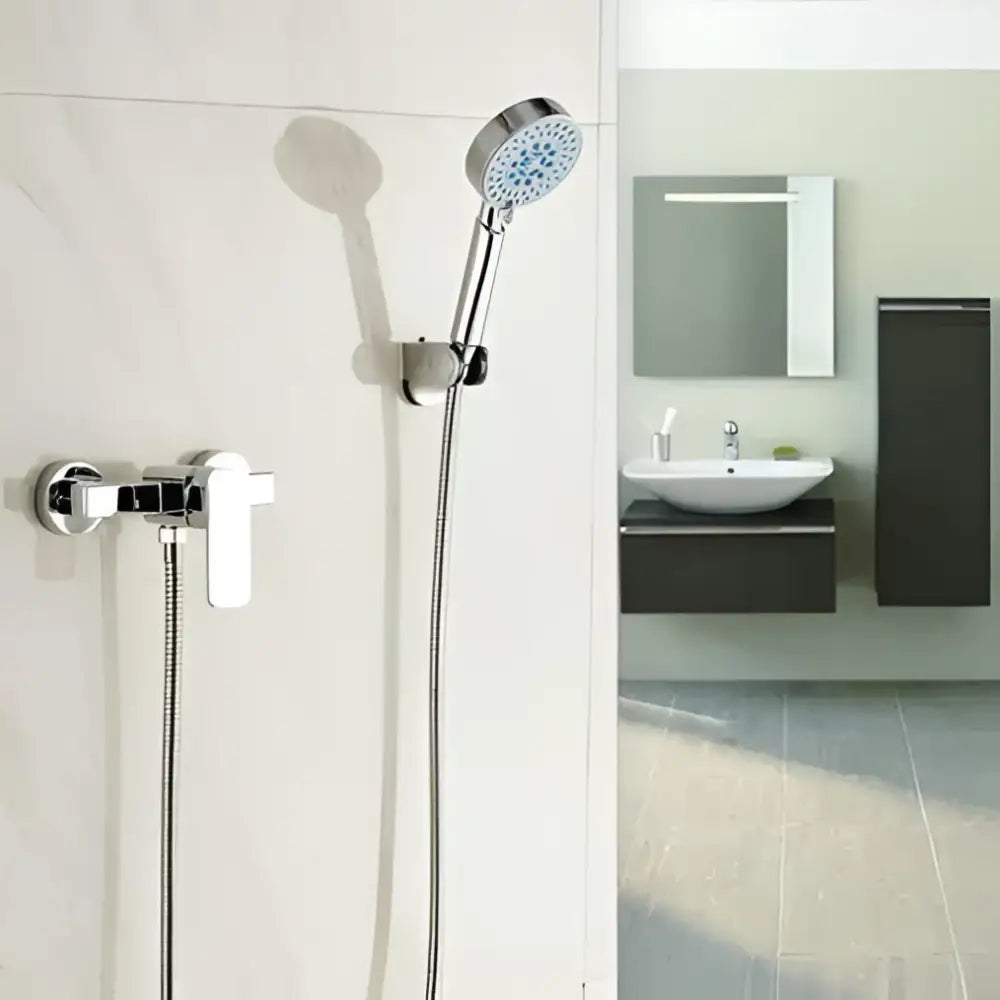 Modern chrome single handle shower mixer with brass single showerhead featuring circular perforated nozzles decorbites bathroom