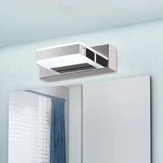 Modern chrome square acrylic vanity light fixture with sleek design mounted above mirror showing fixture height