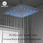 Modern chrome square rainfall shower head with led lights and blue illuminated spray nozzles for bathroom use