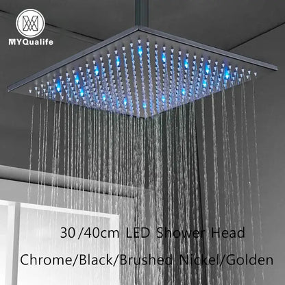Modern chrome square rainfall shower head with led lights and blue illuminated spray nozzles for bathroom use