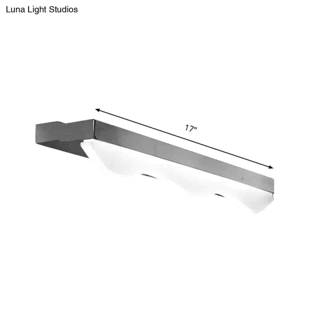 Modern chrome stainless steel vanity light featuring a 17-inch frosted glass linear LED design for bathrooms