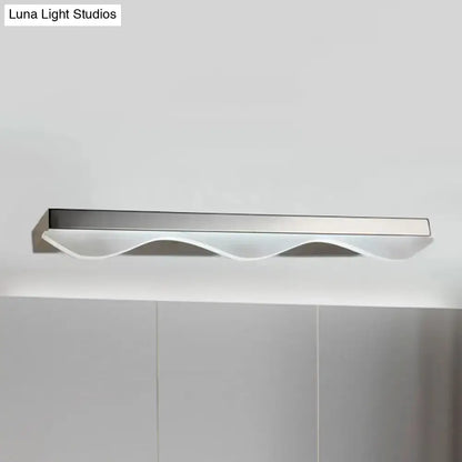 Modern chrome stainless steel vanity light with silver finish and wavy translucent diffuser for bathroom walls