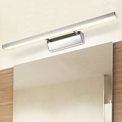 Modern chrome stainless steel stick vanity light fixture with sleek rectangular led design mounted above mirror