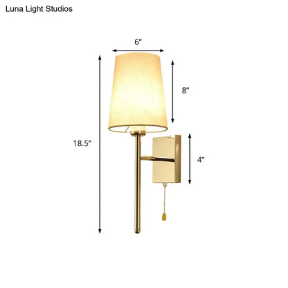 Gold-finished tapered wall sconce with beige fabric shade and rectangular backplate modern chrome tapered wall light