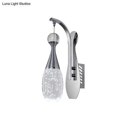 Modern chrome teardrop led sconce with sleek curved arm and seeded crystal glass shade for bedroom wall lighting