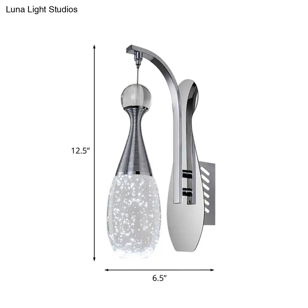 Modern chrome teardrop led sconce with a sleek curved arm and bubble-patterned glass shade for bedroom lighting