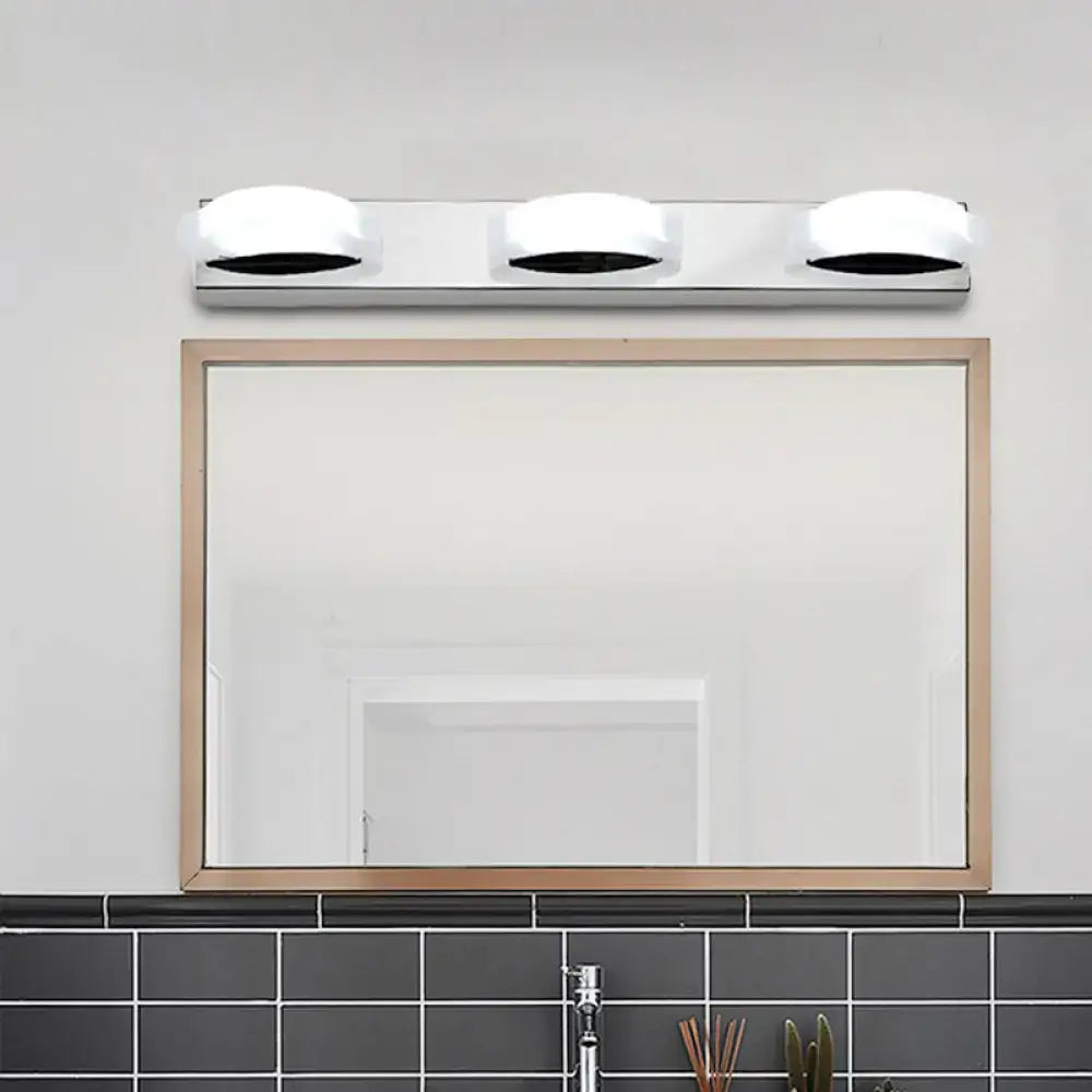 Modern chrome three light vanity mirror light with sleek chrome finish frosted shades and white warm color temperature