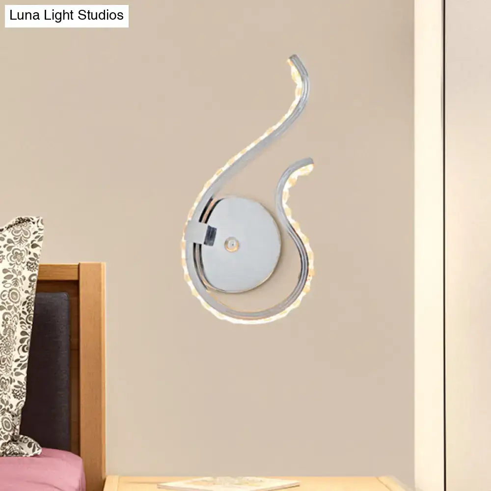 Modern chrome twist led wall light with sleek curved design and warm white light for bedroom wall lighting