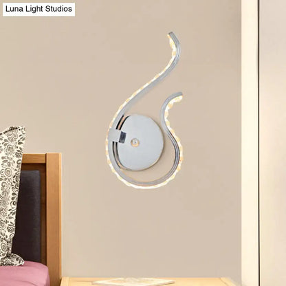 Modern chrome twist led wall light with sleek curved design and warm white light for bedroom wall lighting