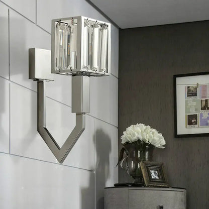 Modern chrome wall lamp with metal frames featuring clear crystal vertical accents for elegant living room lighting