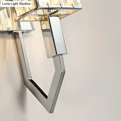 Modern chrome wall lamp with clear crystal accents and metal frames featuring a geometric angular design for living rooms