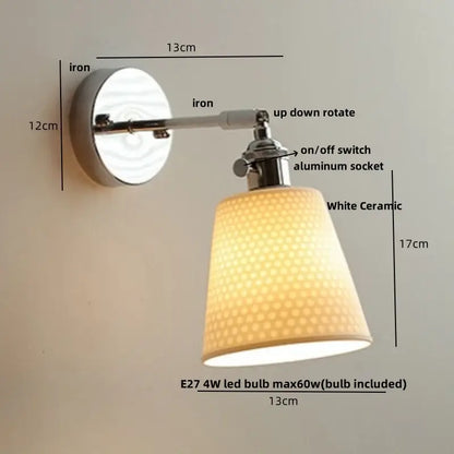 A sleek modern chrome wall light with a white perforated ceramic led shade and polished iron mount for bedroom decorbites ceramic led wall