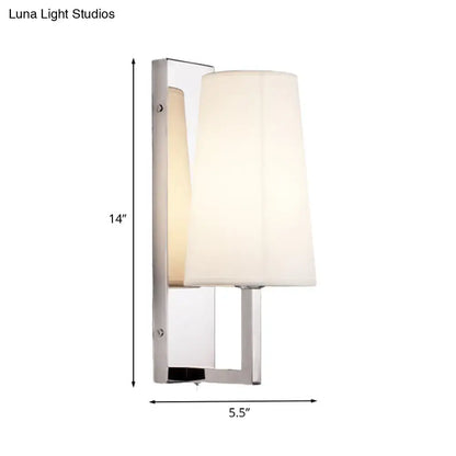 Modern chrome wall sconce light with sleek finish and handmade cone fabric shade for bedroom use