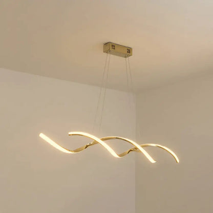Gold-toned modern led island lighting pendant with sleek curved design and three intertwined arms for kitchen use