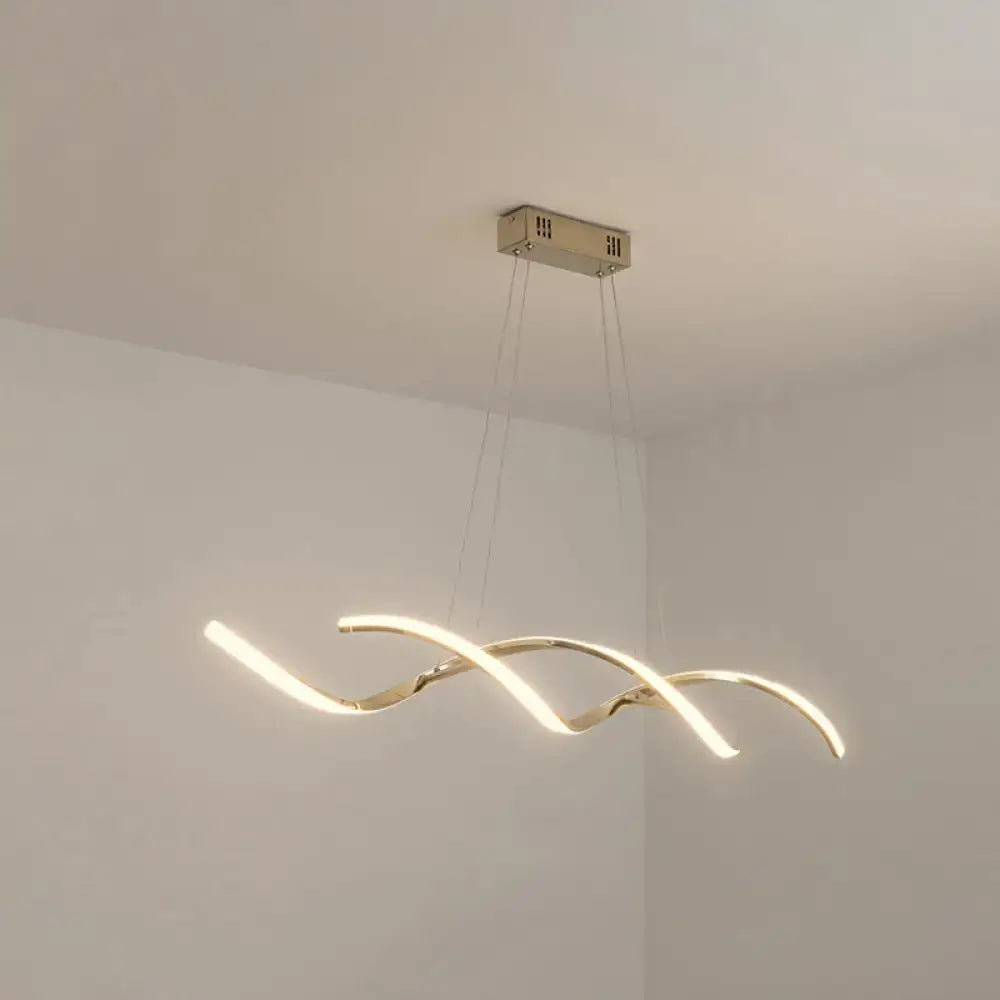 Modern chrome wave led island lighting with gold-toned curved design and warm ambient LED island lighting for kitchens